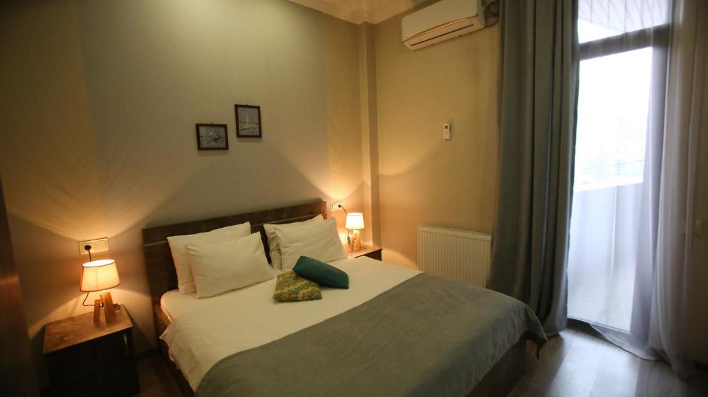 Postel nebo postele na pokoji v ubytování Hotel Nabadi