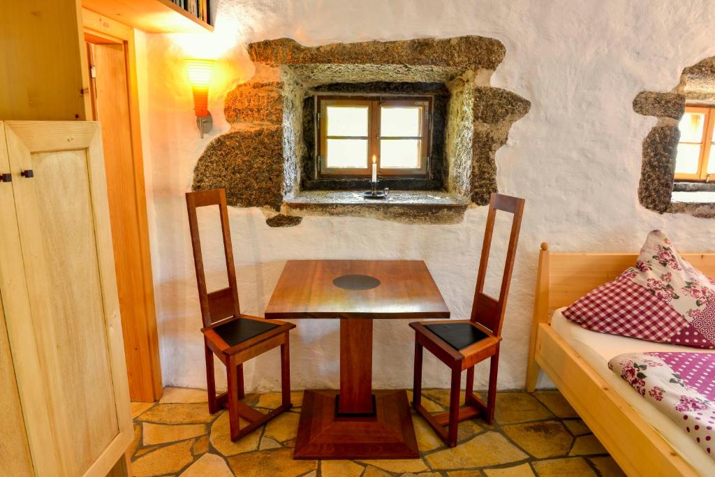 Postel nebo postele na pokoji v ubytování Hofatelier Menacher