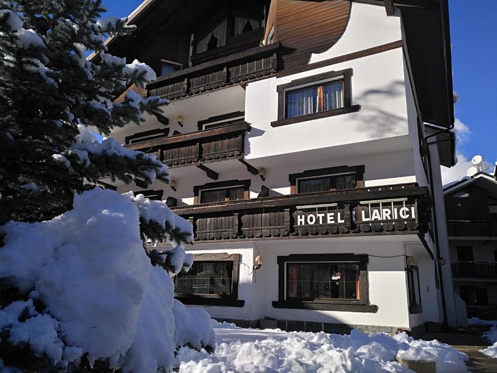 a hotel building with snow in front of it at Hotel I Larici in Bardonecchia