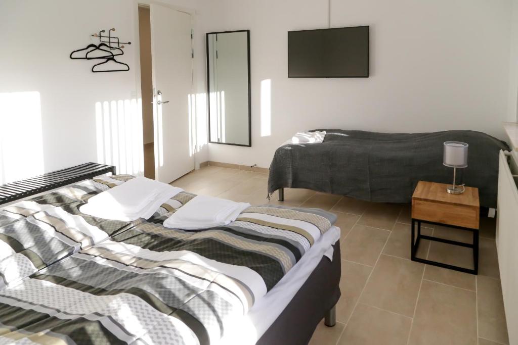 Ένα ή περισσότερα κρεβάτια σε δωμάτιο στο Hotel Ikast