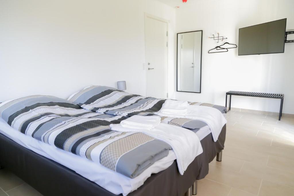 Ένα ή περισσότερα κρεβάτια σε δωμάτιο στο Hotel Ikast