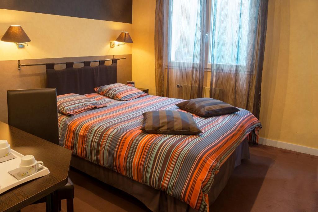 Postel nebo postele na pokoji v ubytování Hostellerie De La Mer