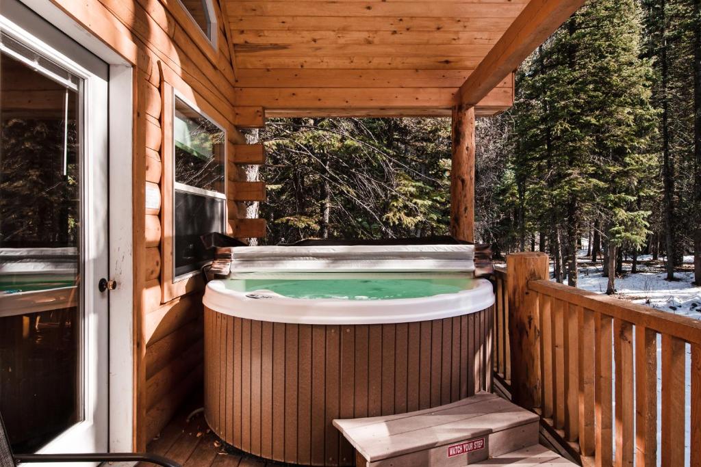 a hot tub on a porch of a house at Moose in South Fork