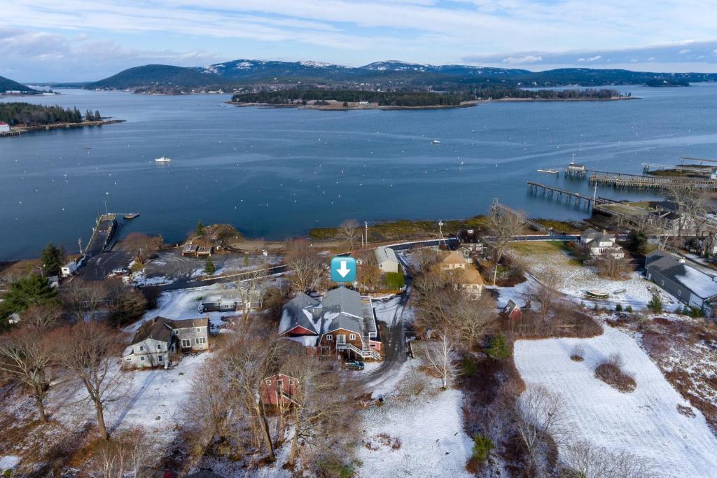 an aerial view of a house on the shore of a lake at Back from the Ashes in Southwest Harbor