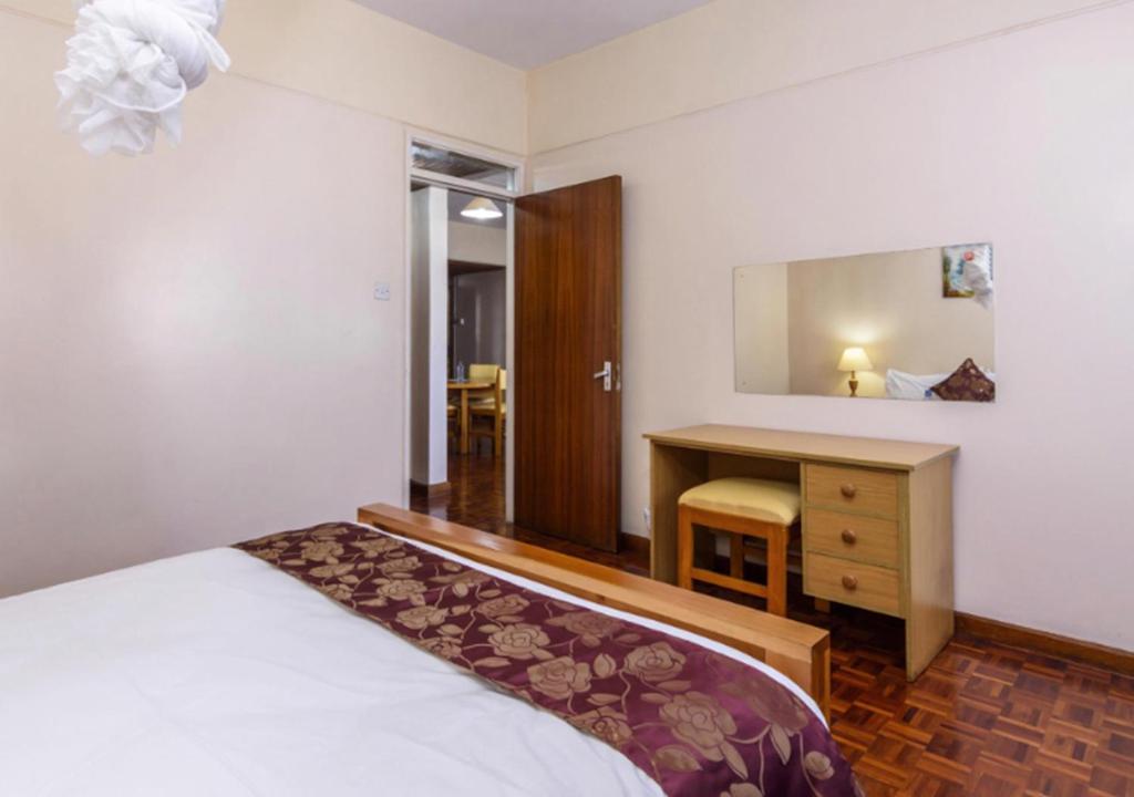 Postel nebo postele na pokoji v ubytování Chester Hotel and Suites Nairobi, City Centre CBD