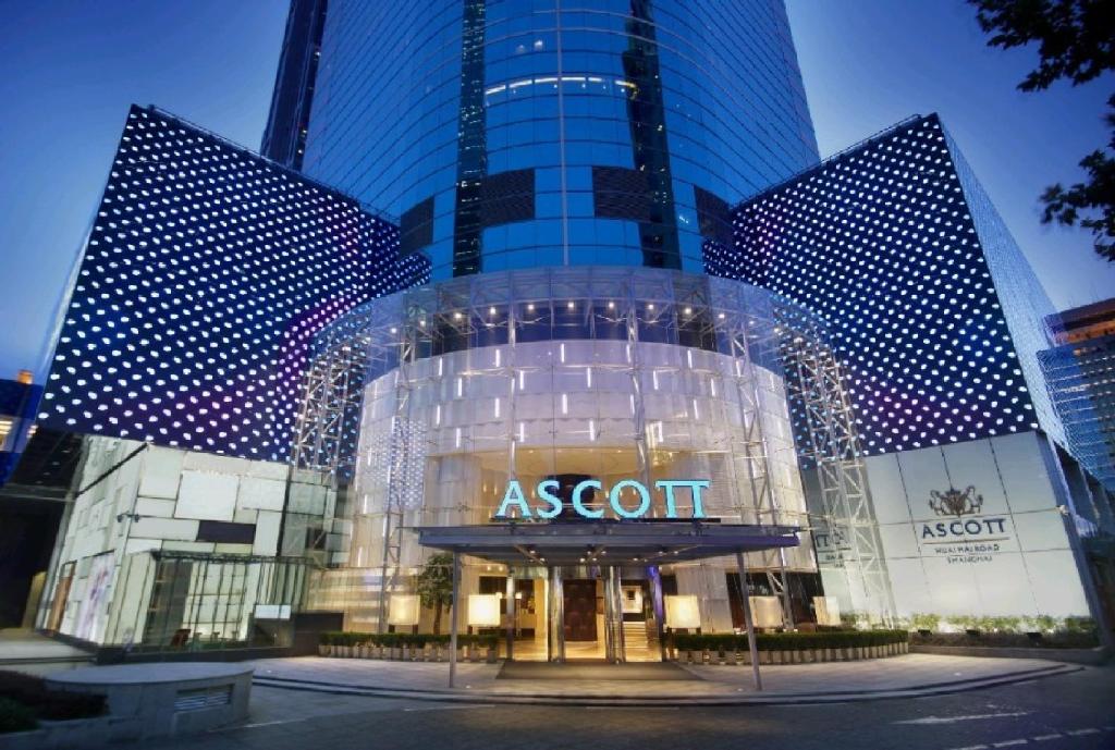 a exterior view of a asot building with a sign on it at Ascott Huai Hai Road Shanghai in Shanghai