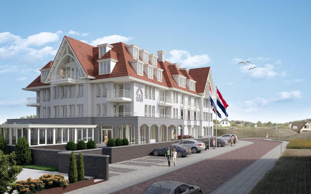 d'un grand bâtiment blanc avec un toit rouge dans l'établissement Villa Zeezicht, à Noordwijk