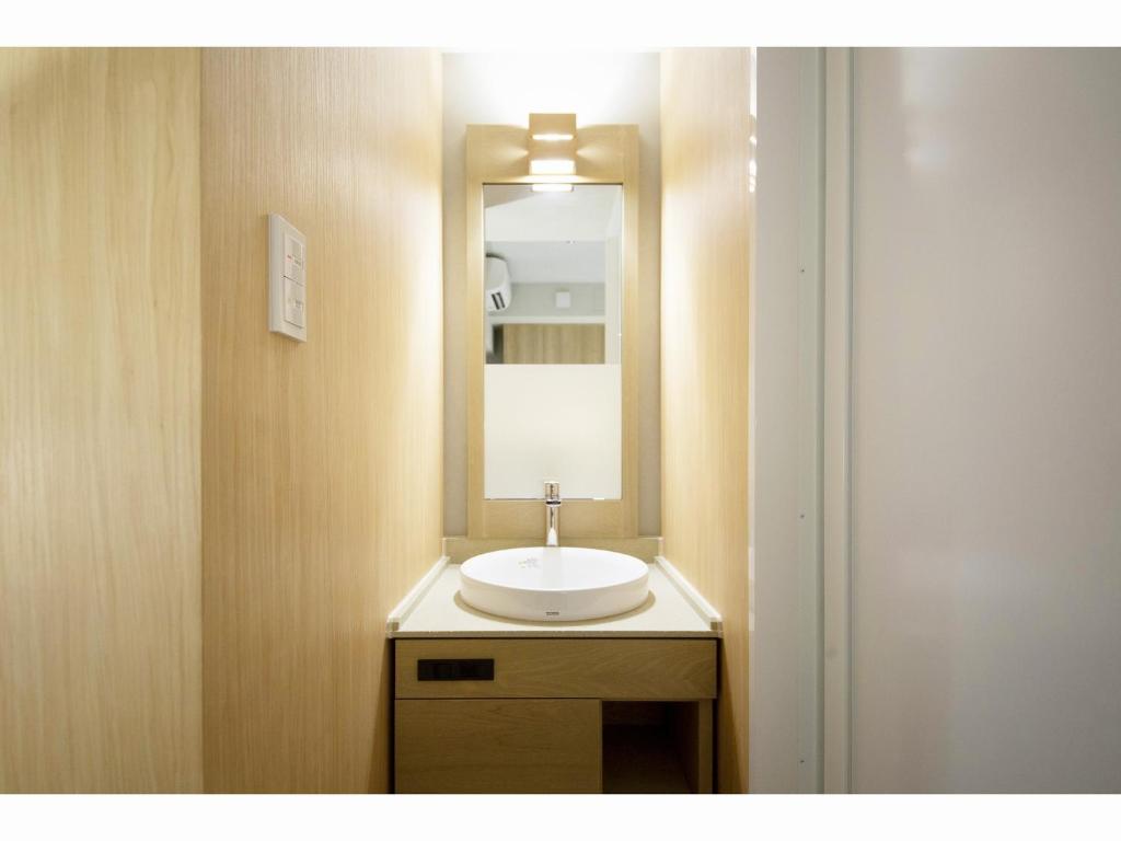 Koupelna v ubytování HOTEL HILLARYS Shinsaibashi