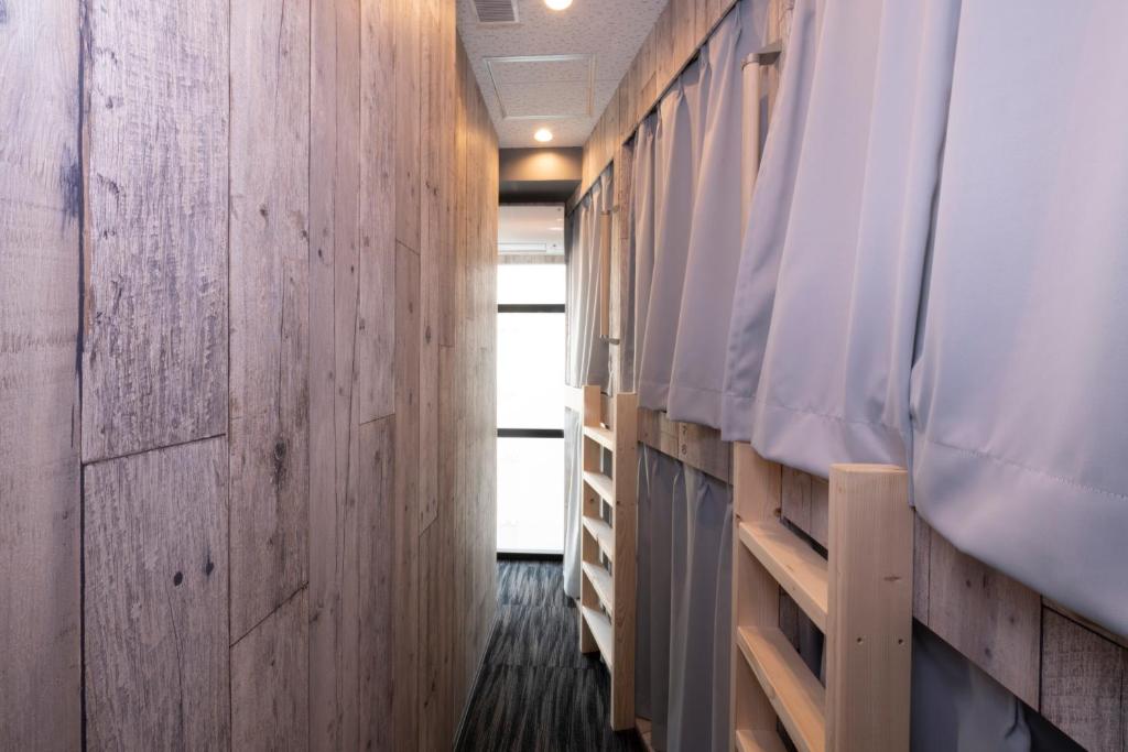 Postel nebo postele na pokoji v ubytování bnb+ Kanda Terrace Ogawamachi