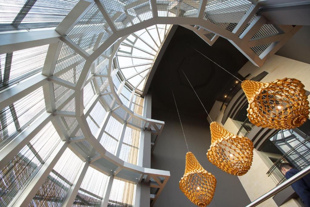 two lights hanging from the ceiling of a building at Ama Islantilla Resort in Islantilla