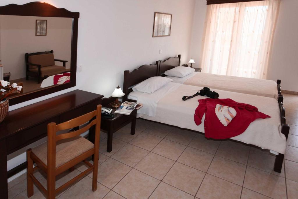 Postel nebo postele na pokoji v ubytování Hotel Melikari