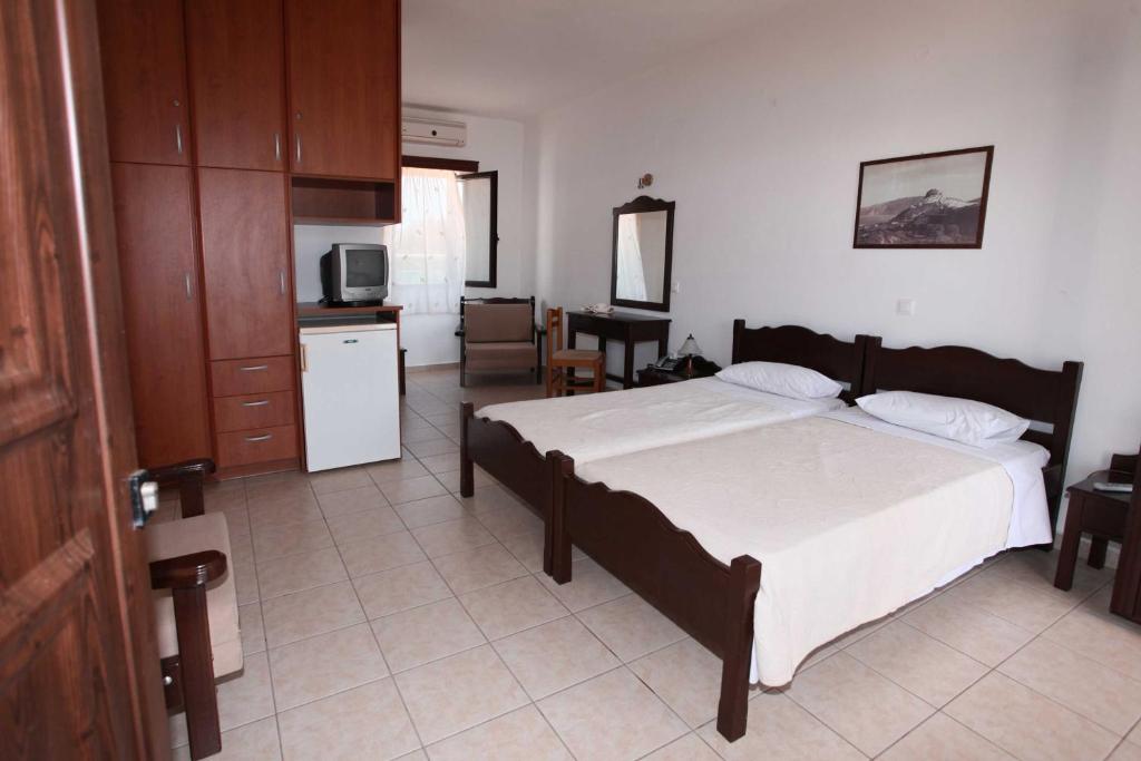 Postel nebo postele na pokoji v ubytování Hotel Melikari