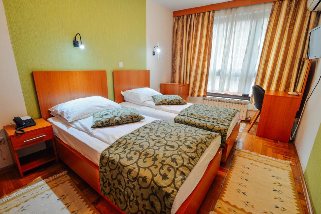 Postel nebo postele na pokoji v ubytování Hotel Mod