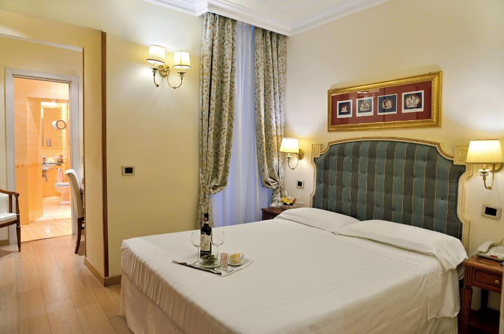 Postel nebo postele na pokoji v ubytování Hotel Homs