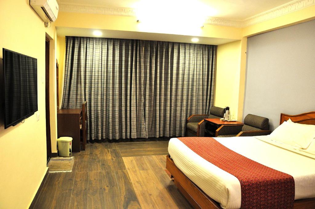 Postel nebo postele na pokoji v ubytování Tibet Guest House