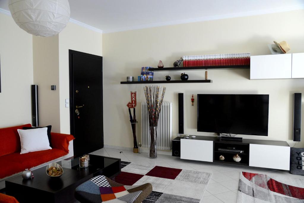 Televízia a/alebo spoločenská miestnosť v ubytovaní My Place