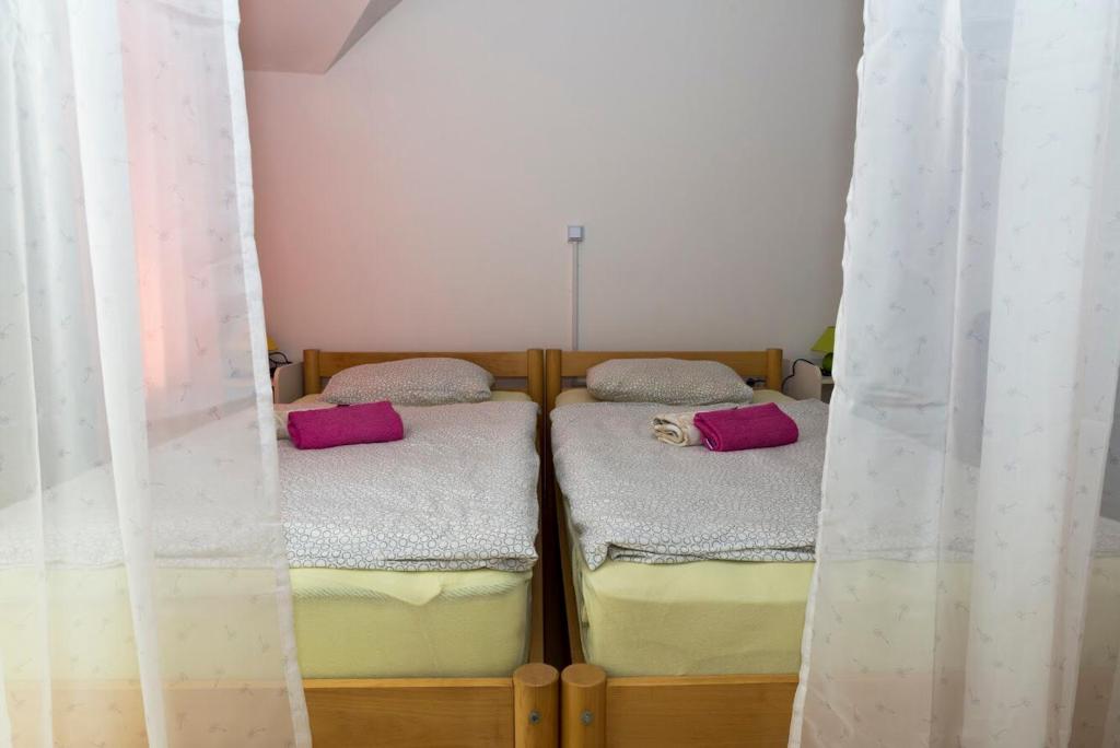 Postel nebo postele na pokoji v ubytování Vila Šiftar