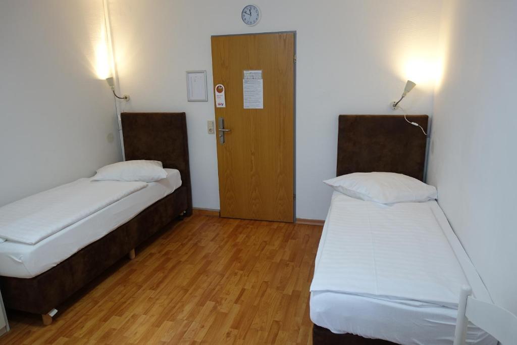 Postel nebo postele na pokoji v ubytování Stern Hotel
