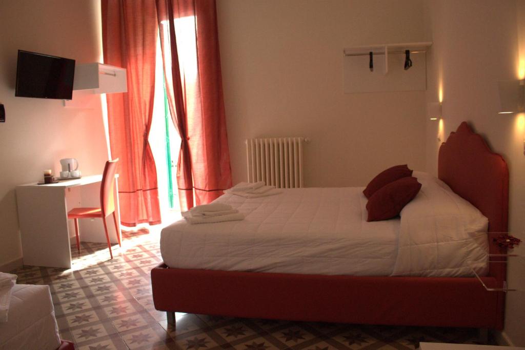 Postel nebo postele na pokoji v ubytování Pietre e Sassi