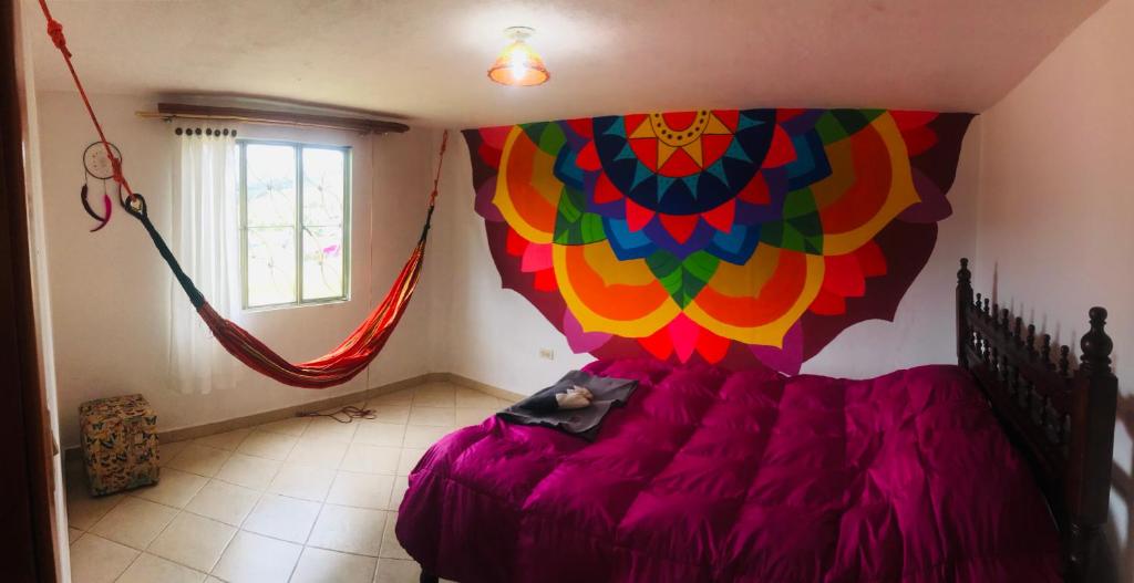 Postel nebo postele na pokoji v ubytování Hostal Casa Lantana