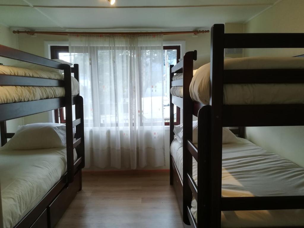 Postel nebo postele na pokoji v ubytování Patagon Backpackers
