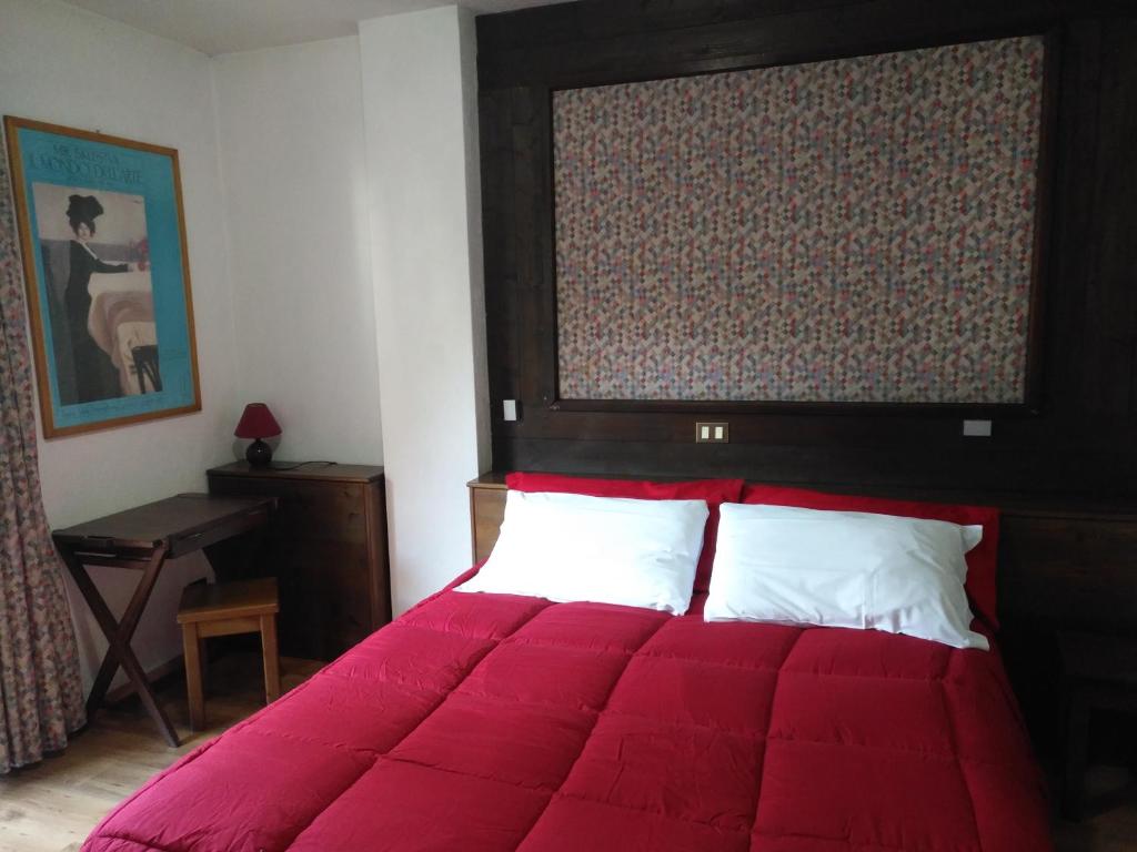 Postel nebo postele na pokoji v ubytování Hotel I Larici
