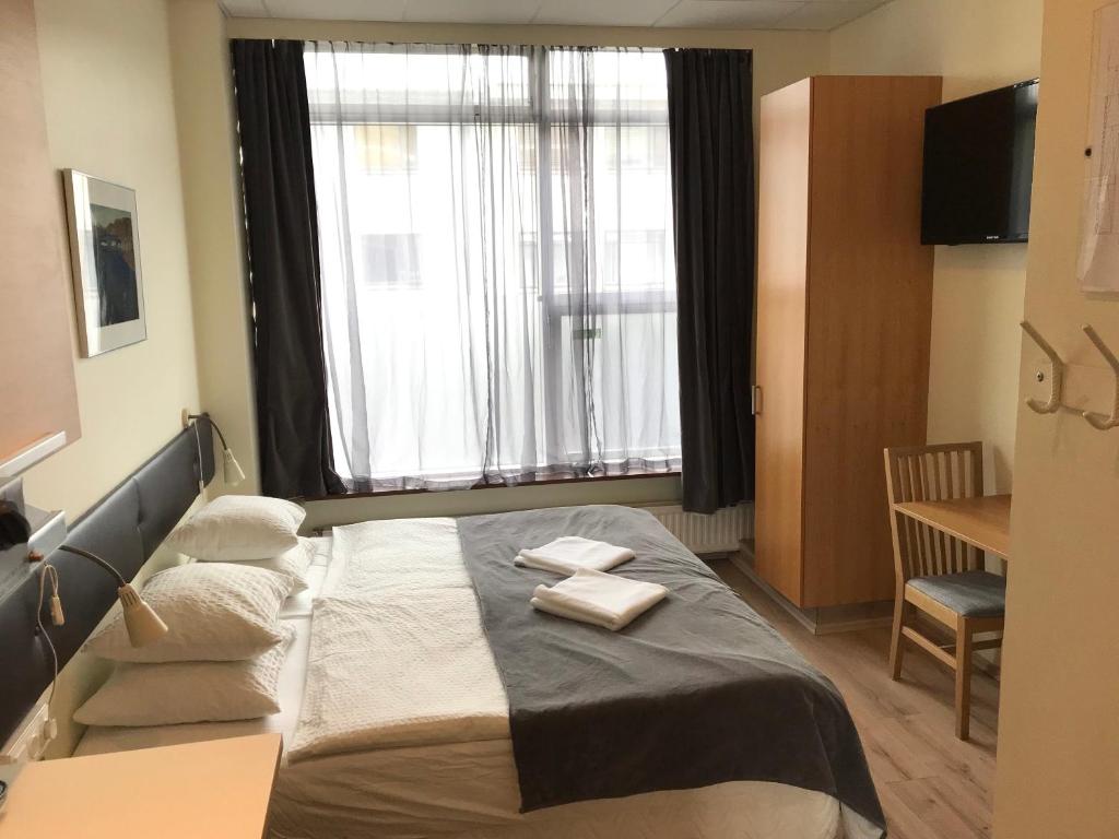 Postel nebo postele na pokoji v ubytování Downtown Reykjavík Apartments