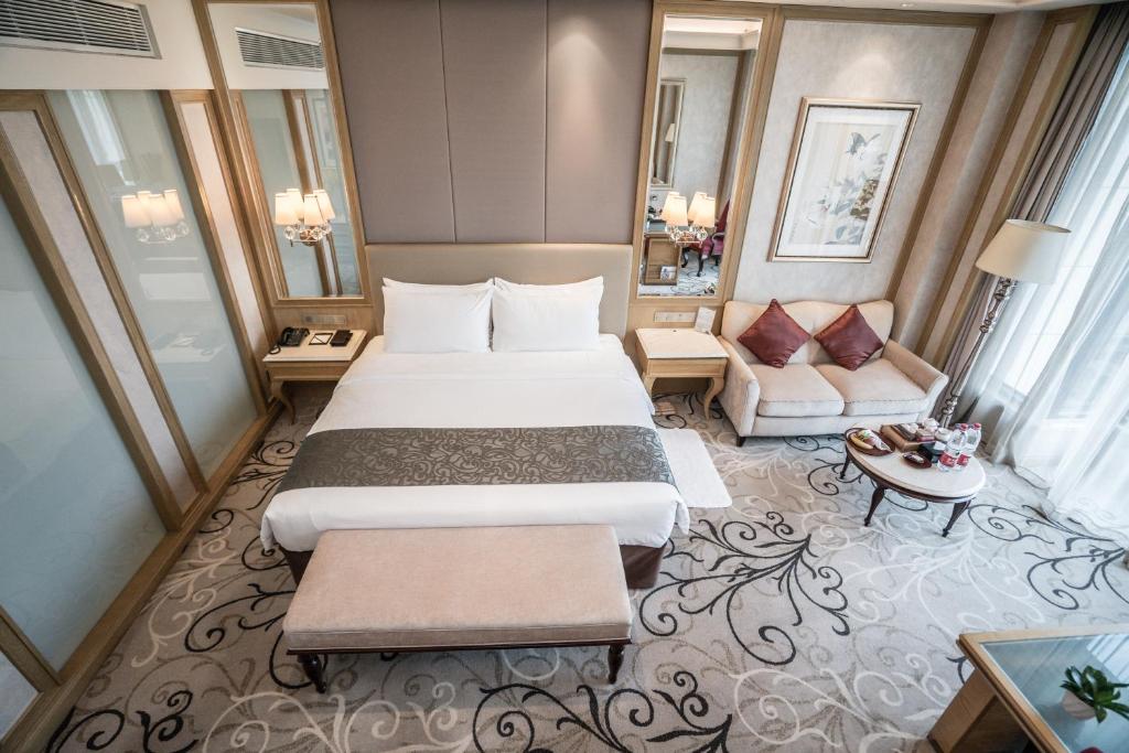 Postel nebo postele na pokoji v ubytování C&D Hotel Fuzhou