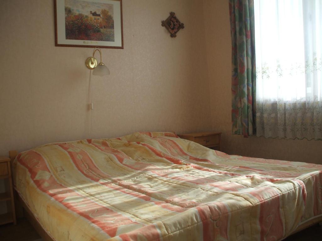 Postel nebo postele na pokoji v ubytování Garabuczi Apartman