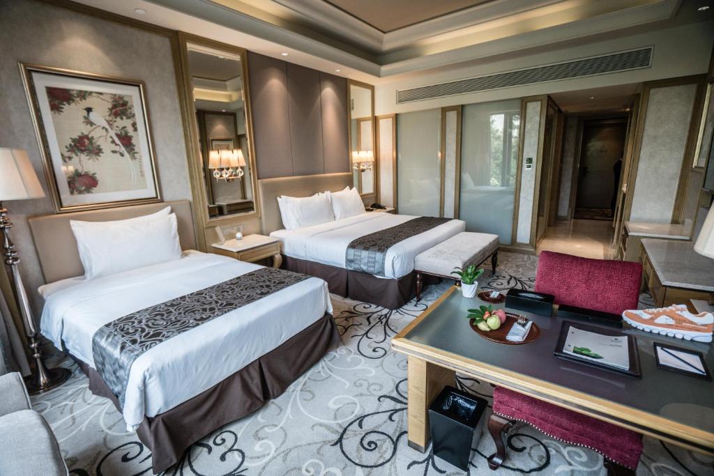 Postel nebo postele na pokoji v ubytování C&D Hotel Fuzhou