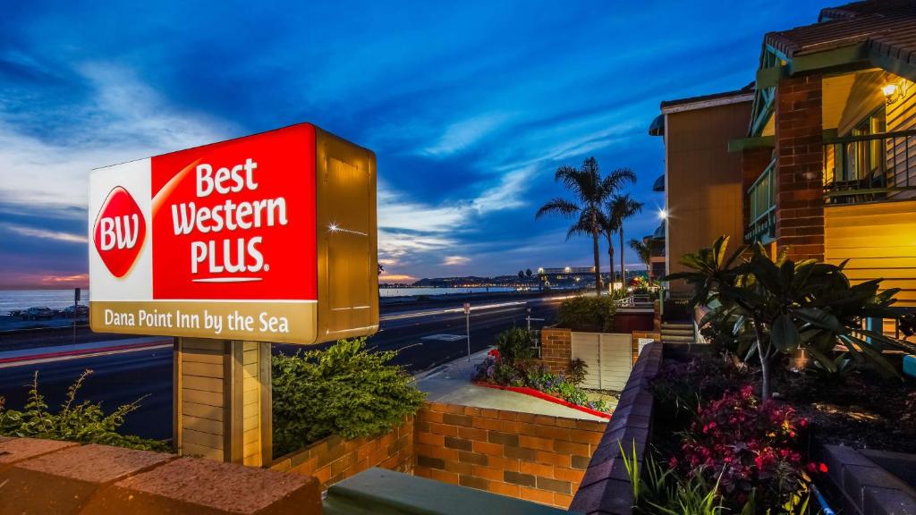 a best western plus sign in front of a building at Best Western Plus Dana Point Inn-by-the-Sea in Dana Point