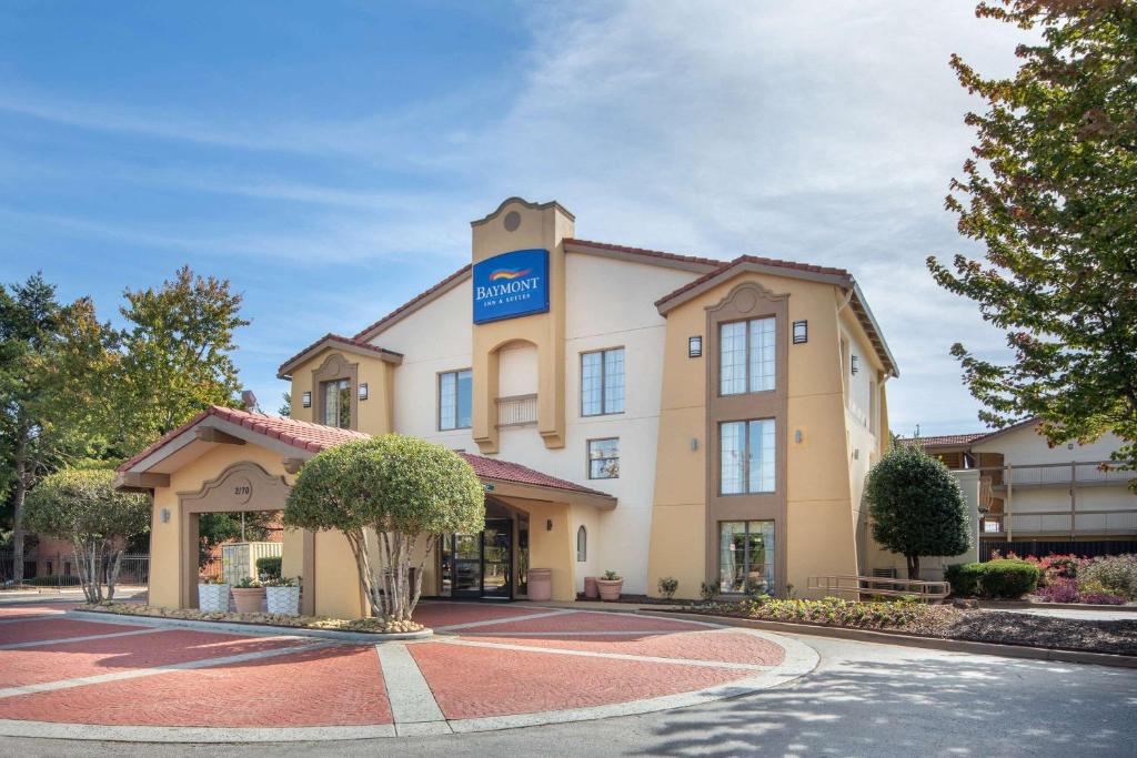 a hotel with a sign on the front of it at Budget Inn & Suite Atlanta Marietta Stadium in Marietta