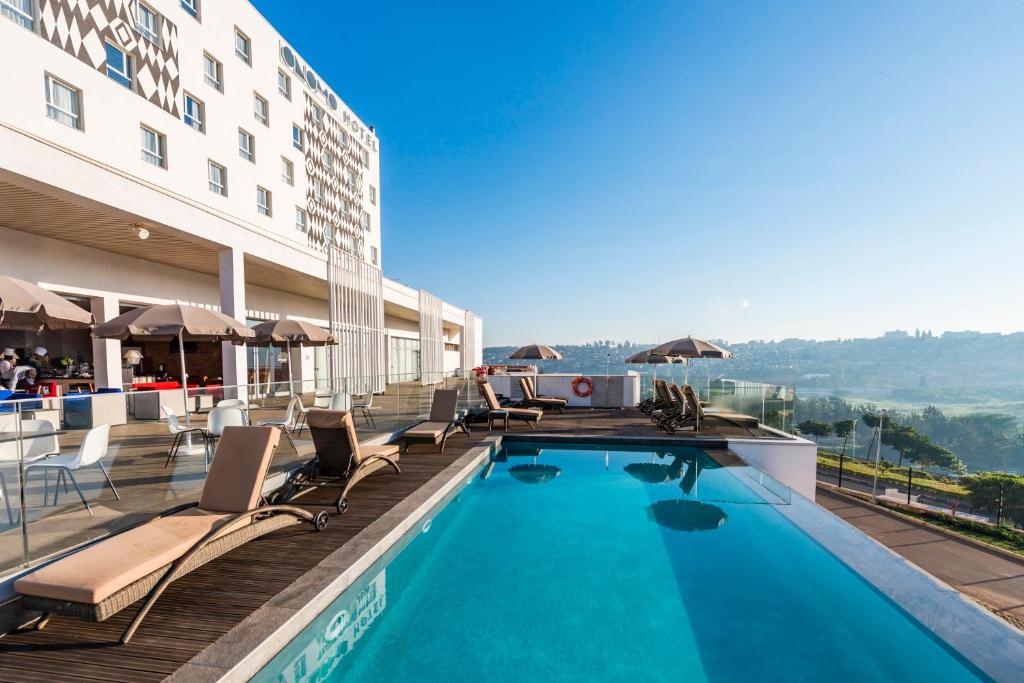 a swimming pool on the roof of a hotel at Onomo Hotel Kigali in Kigali