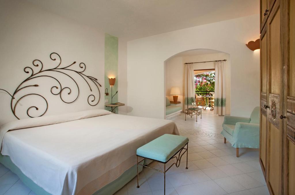 Postel nebo postele na pokoji v ubytování Resort Cala Di Falco