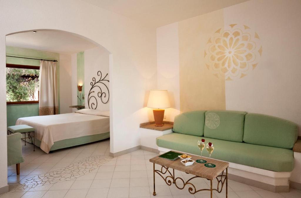 Postel nebo postele na pokoji v ubytování Resort Cala Di Falco
