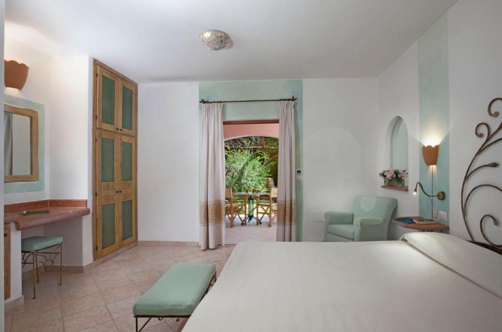 Postel nebo postele na pokoji v ubytování Resort Cala Di Falco