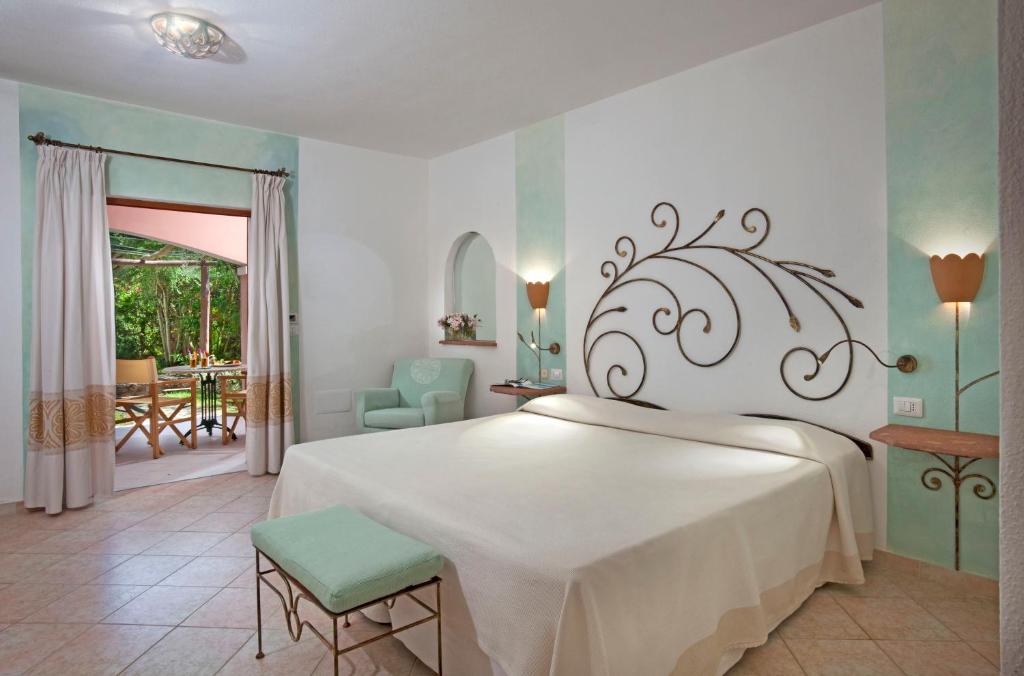 Postel nebo postele na pokoji v ubytování Resort Cala Di Falco