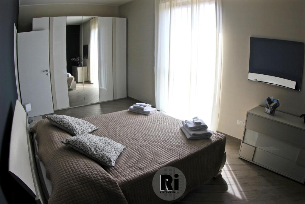 Łóżko lub łóżka w pokoju w obiekcie Residenze Italia