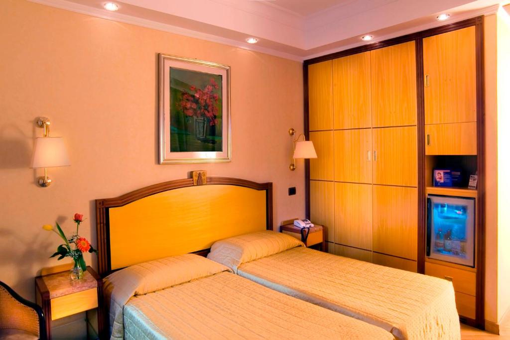 Postel nebo postele na pokoji v ubytování Hotel Oxford