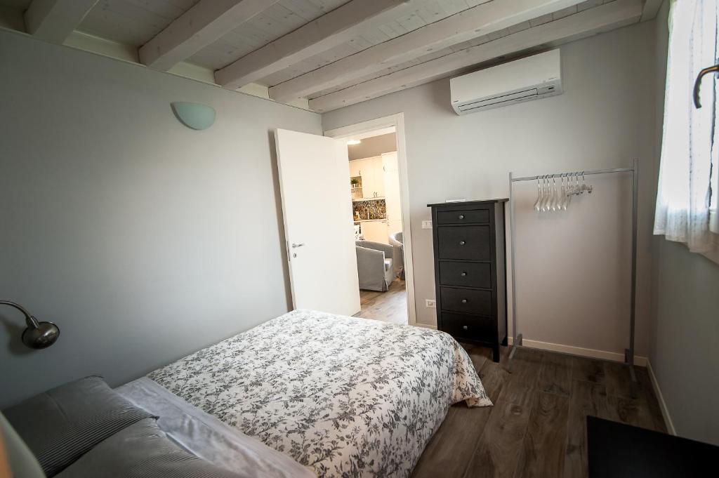 Postel nebo postele na pokoji v ubytování Particolari del Brenta