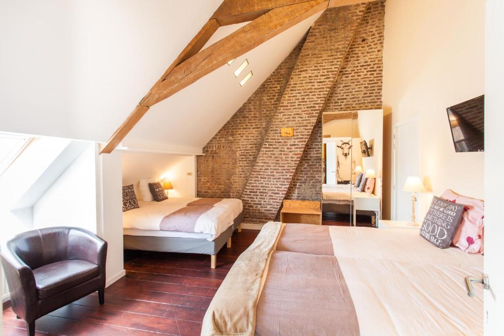 Postel nebo postele na pokoji v ubytování Hotel Het Wethuys