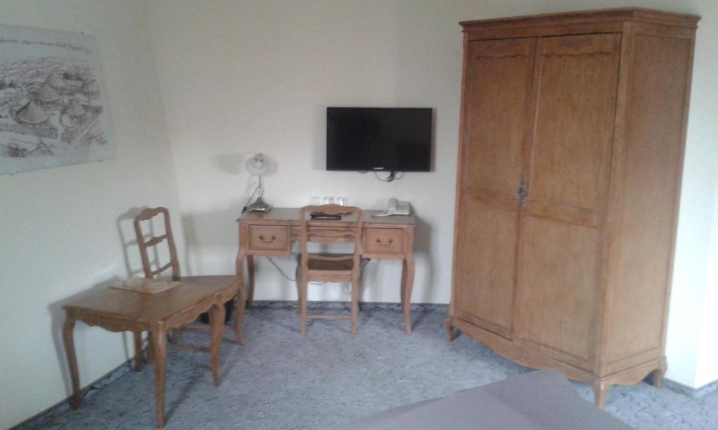 TV a/nebo společenská místnost v ubytování Malom Hotel