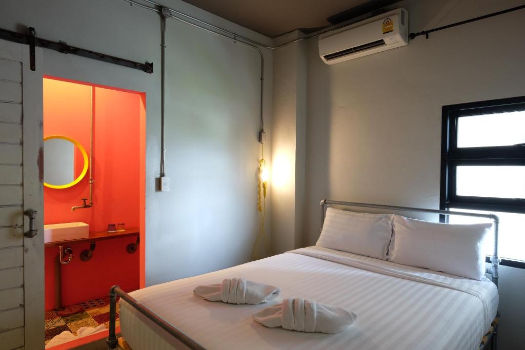 Postel nebo postele na pokoji v ubytování Bloo Hostel