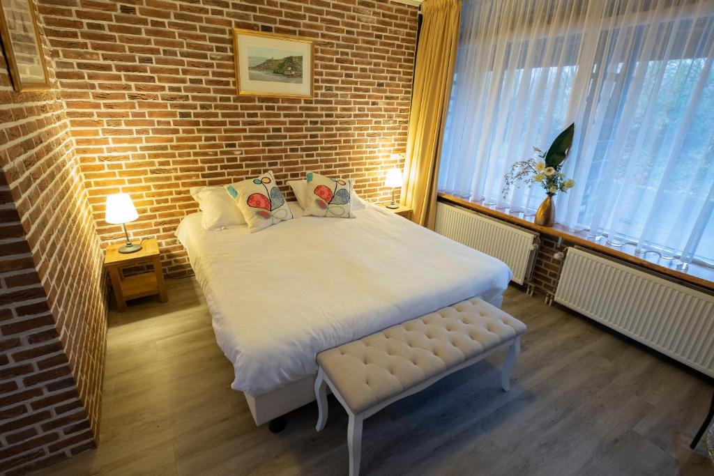 Postel nebo postele na pokoji v ubytování Buitengoed de Panoven