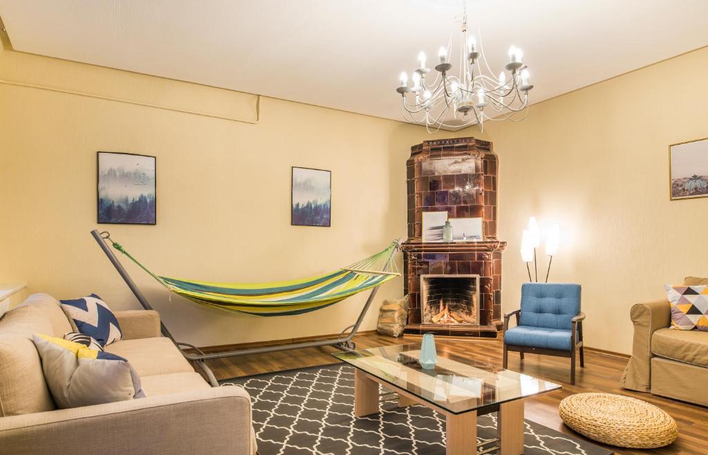 a living room with a hammock on the wall at Charming spacious 3 bedroom in Old Town in Riga