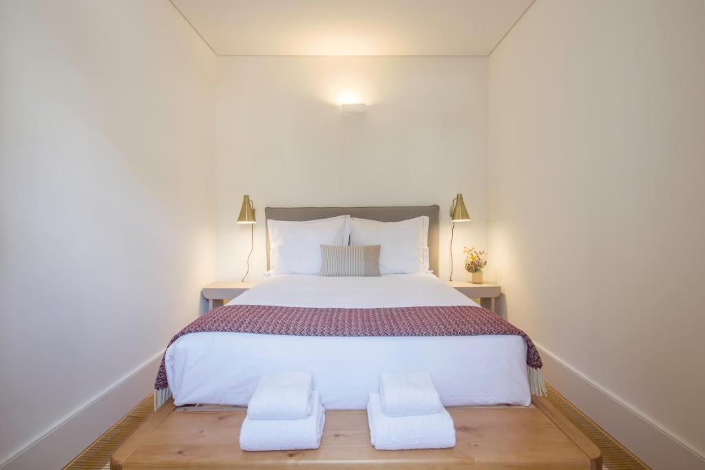 Postel nebo postele na pokoji v ubytování Oporto Sweet Home IV