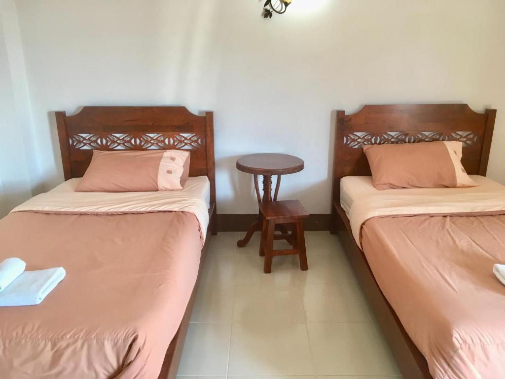 Postel nebo postele na pokoji v ubytování Phumchanplace