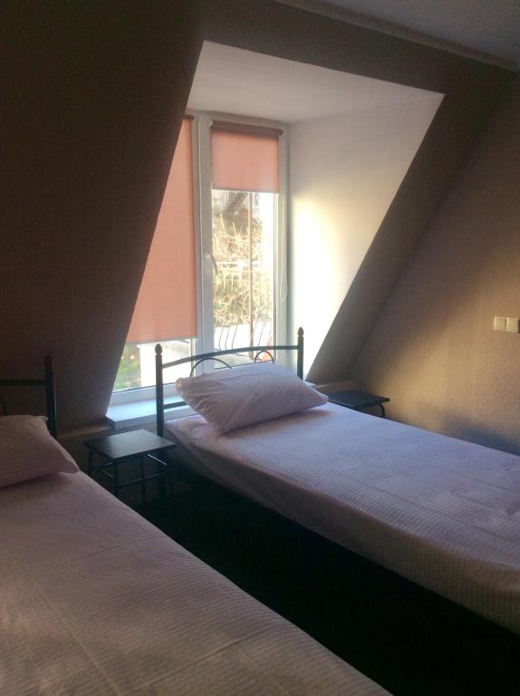 Postel nebo postele na pokoji v ubytování hostel Koleso