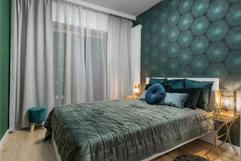 Posteľ alebo postele v izbe v ubytovaní Mennica Residence Chic Apartment