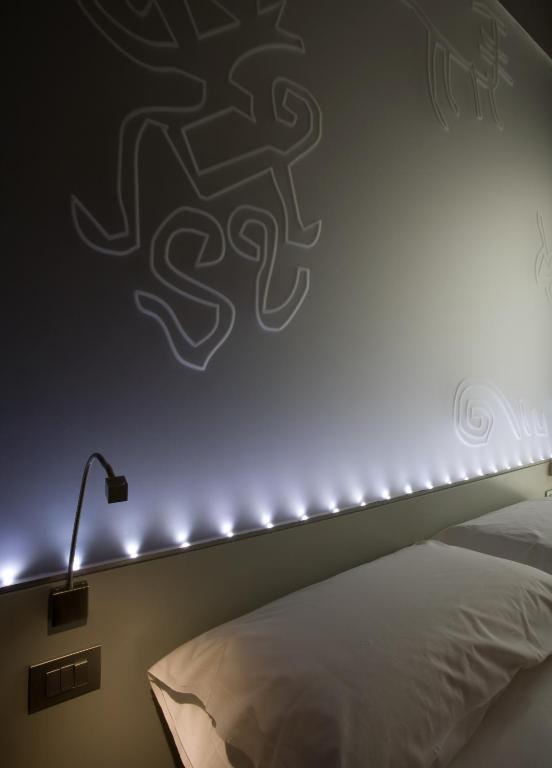 Postel nebo postele na pokoji v ubytování Eos Hotel